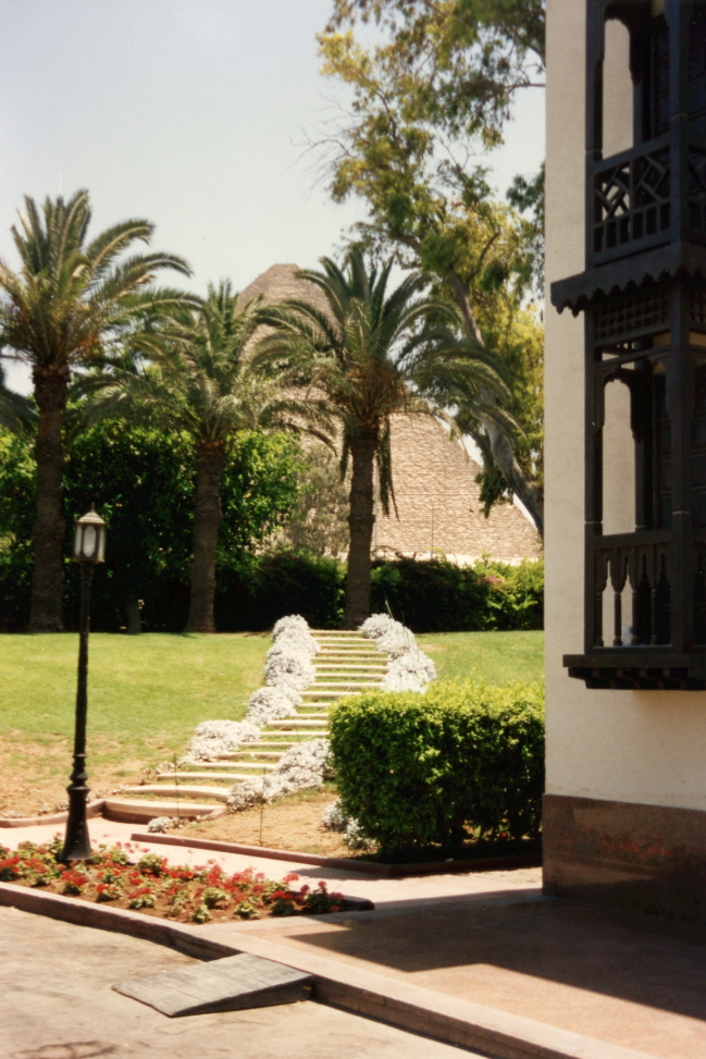 Grounds of the Mena House Oberoi with pyramid beyond