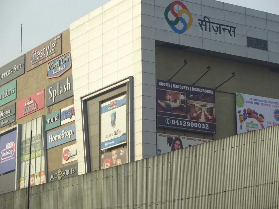 Seasons Mall at the entrance to Magarpatta City with store signs all over the exterior