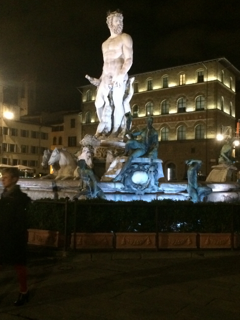 The Neptune statue at night.