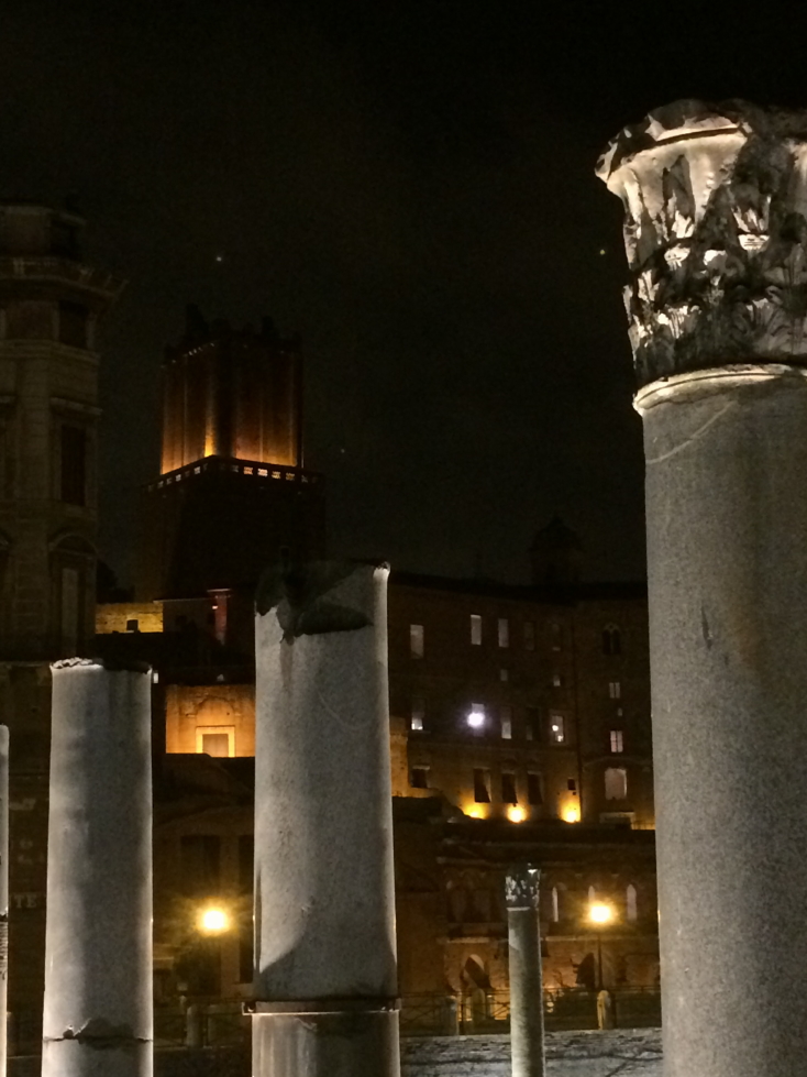 Imperial Forum columns with floodlit Torre della Milizie in the distance