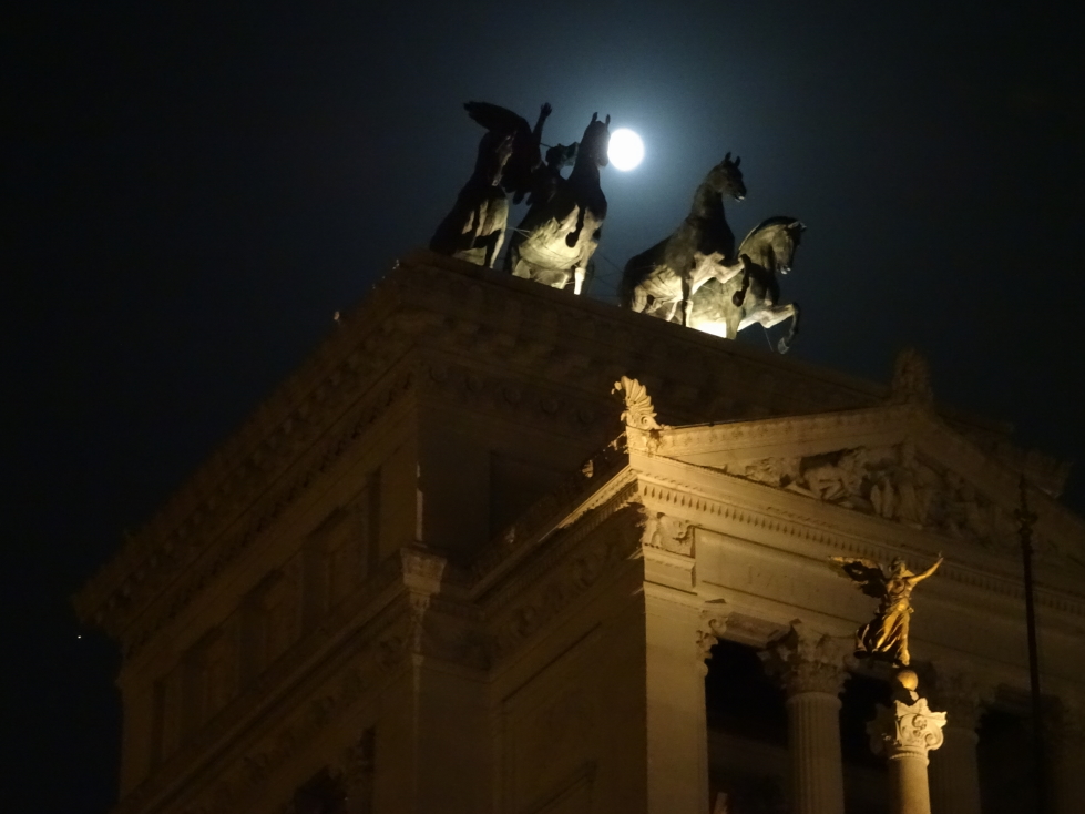 Victory goddess atop Altare della Patria backlit by the moon