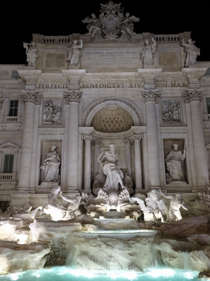 Trevi Fountain takes up the entire side of a building