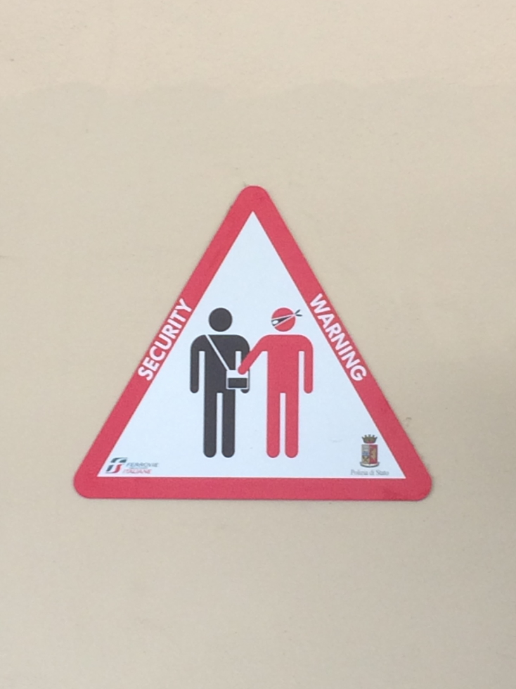 Sign at the train station warning of pickpockets