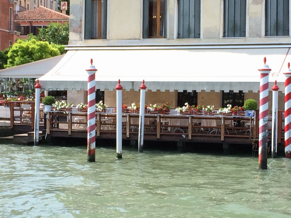 Striped poles in Venice's Grand Canal