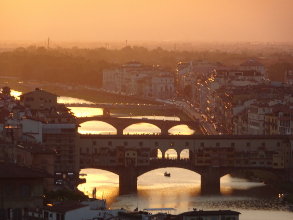 Bridges over the Arno lit by the setting sun