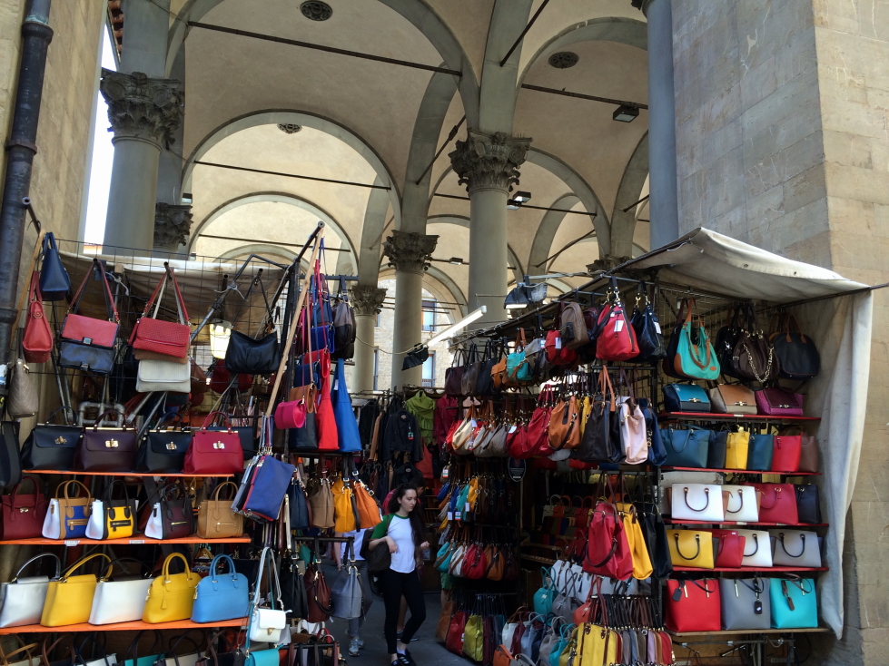 Vendor selling leather goods in Florence