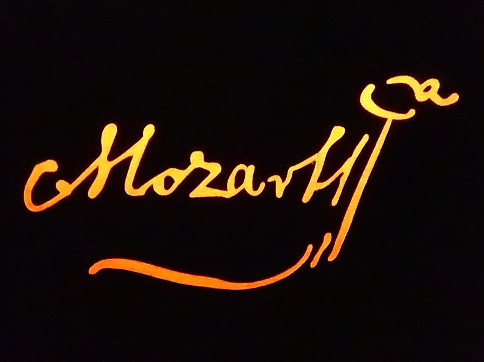 Mozart's signature in glowing light at Haus der Musik