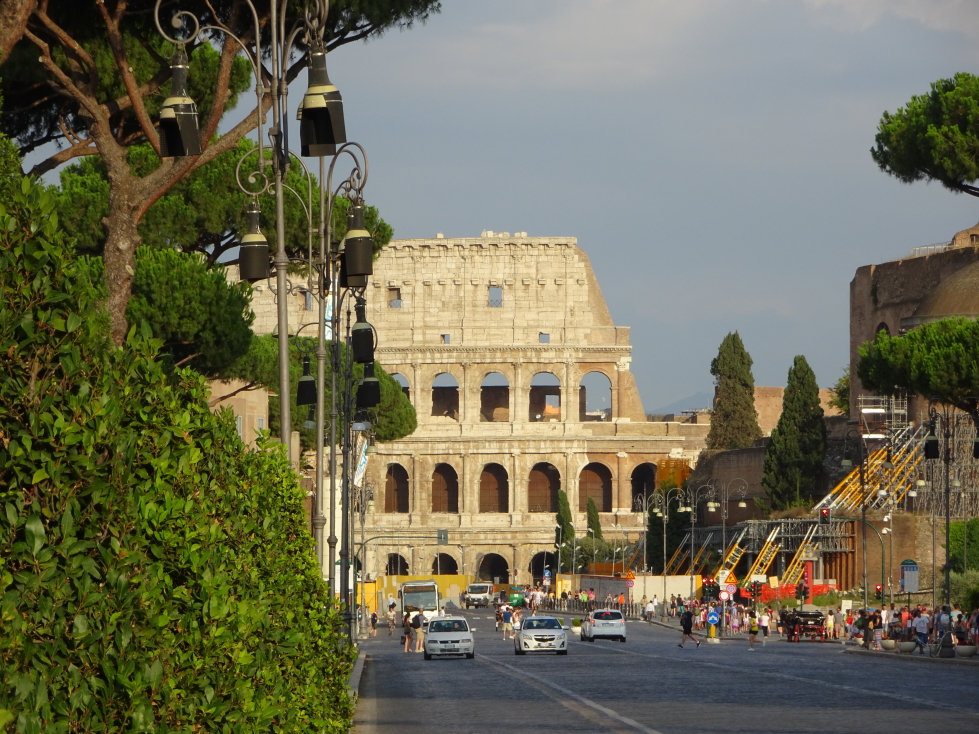 View down the road at the Colosseum, note the scaffolding on the right propping up some ruins