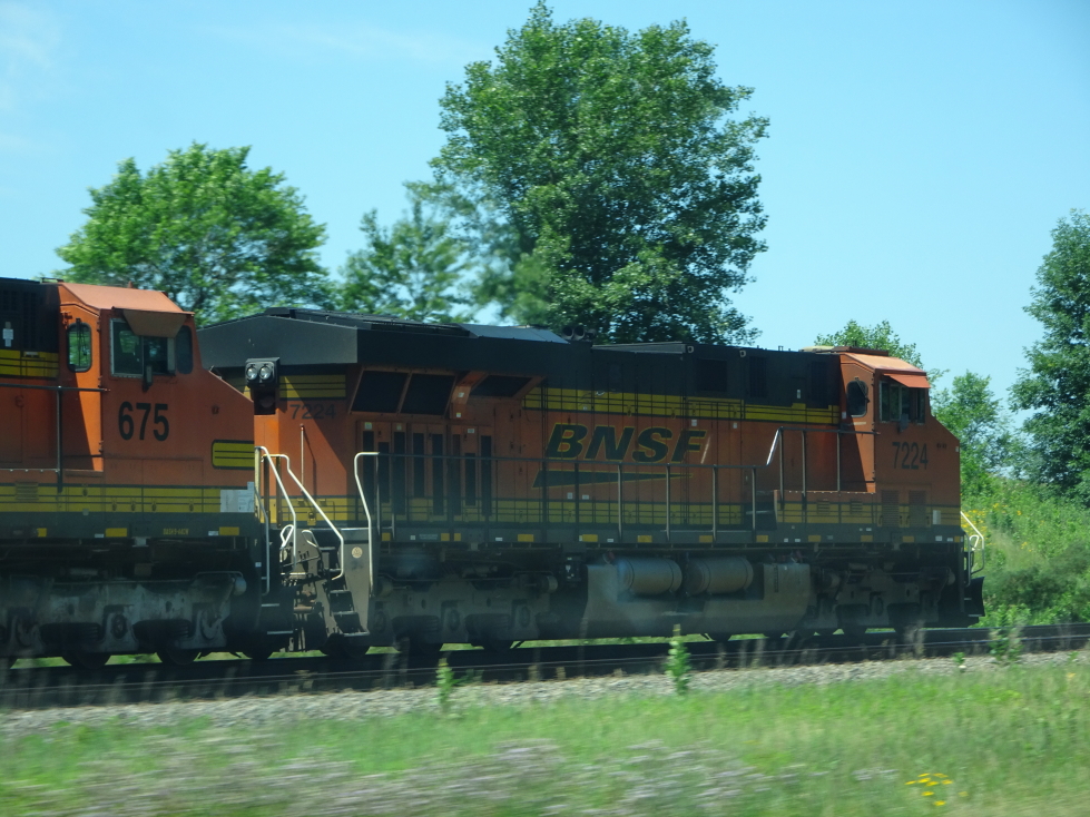 BNSF engines hauling freight along the Mississippi